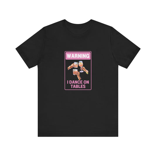 🕺💃 Unleash Your Inner Party Animal with Our "Warning I Dance on Tables" T-Shirt! 💃🕺  Short Sleeve Tee