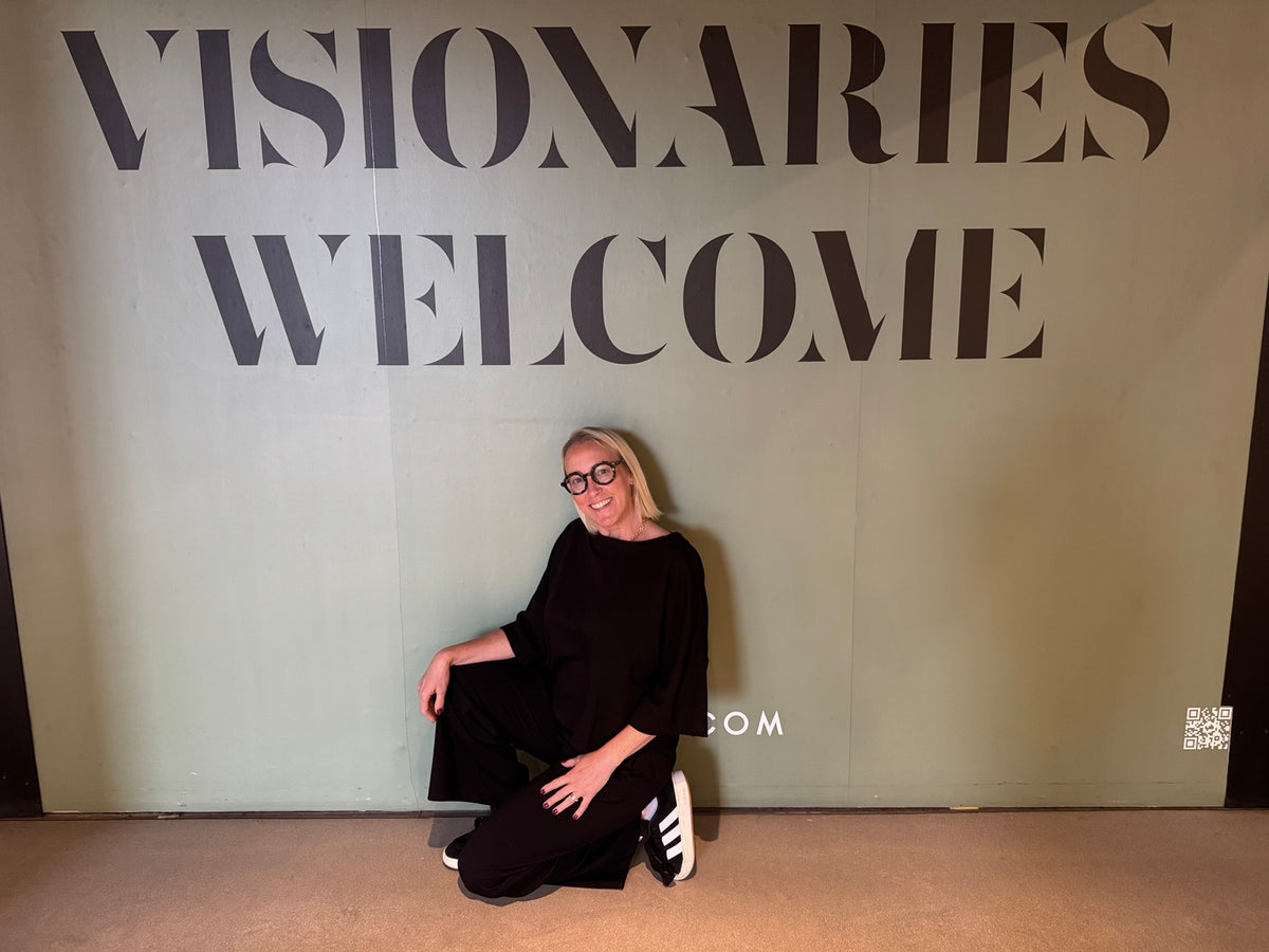 Artist Blakely Bering beneath the words Visionaries Welcome.