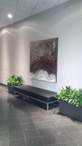 Blakely Bering abstract painting installed above a bench at Griffin Partners.