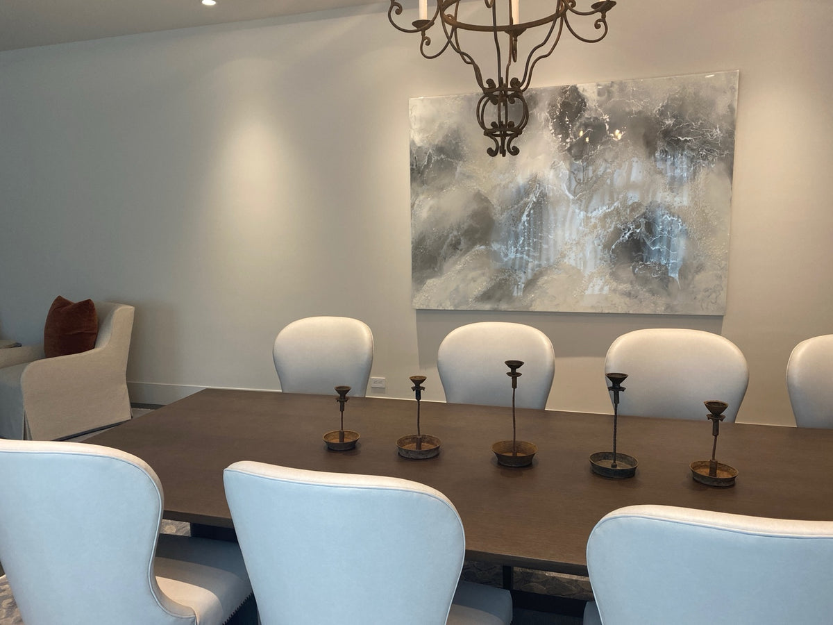 Large neutral abstract painting in a residential dining room.